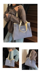 Detailed view of striped canvas tote bag showing the WEGOCO label and beige shoulder strap