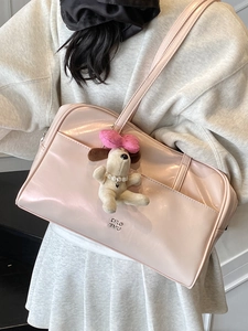 Pink glossy patent leather tote bag for women with a cute plush dog charm and metal logo