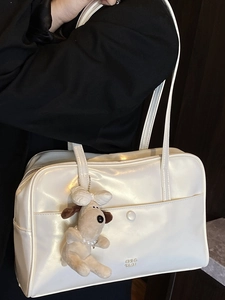 Glossy white minimalist tote bag with chic dog pendant and pearl strap for women