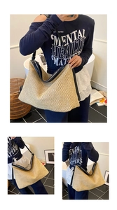 Close-up of woven straw tote bag with black leather straps and secure zipper closure