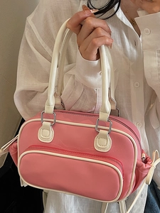 Pink and white minimalist crossbody handbag shown with a clean white shirt outfit