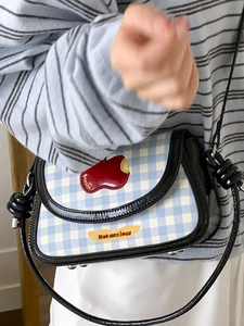 Summer 2025 blue checkered saddle bag with red apple patch and black leather strap