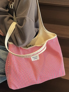 Minimalist red and white striped tote bag with leather straps for casual summer style