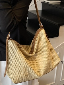 Large woven tote bag with brown faux leather straps for summer casual and commuting use