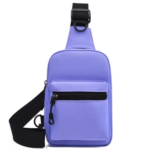 Detail view of purple nylon chest bag with adjustable black strap and metal D-ring
