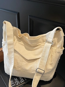 Large capacity cream canvas messenger bag with utility pockets and wide strap
