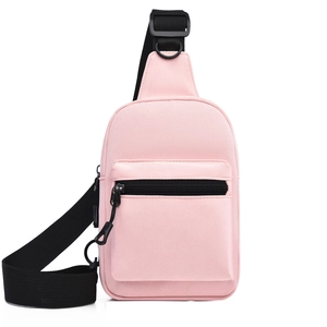 Detail of light pink canvas crossbody bag with adjustable wide black nylon shoulder strap