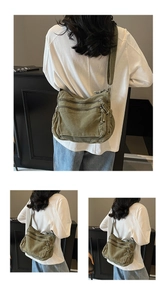 Detail of army green canvas crossbody bag featuring multi-pocket utility design and zippers