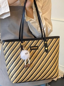 Retro striped woven tote bag with leather handles and a cute plush ball charm