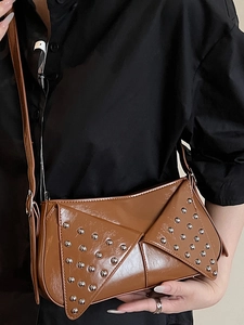 Vintage brown rivet shoulder bag with shiny oil wax finish and geometric flap design