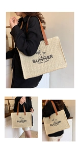 Detail of woven straw tote bag with brown leather handles and SUMMER palm tree embroidery