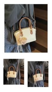 Detailed views of beige bucket bag with crocodile texture, brown handle, and bear charm