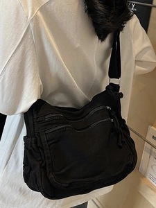 Retro black canvas crossbody bag with multi-zipper pockets and adjustable strap for women