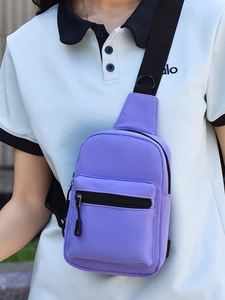 Minimalist purple nylon chest bag with black adjustable strap and front zipper pocket