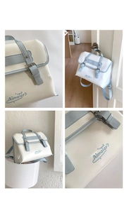 Vues détaillées d'un sac à dos fourre-tout blanc lait et bleu bébé avec broderie