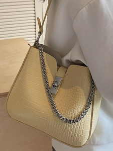 Fashionable yellow faux leather shoulder bag with crocodile pattern and silver metal chain strap