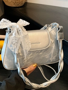 Silver metallic shoulder bag with white lace bow decoration and woven strap