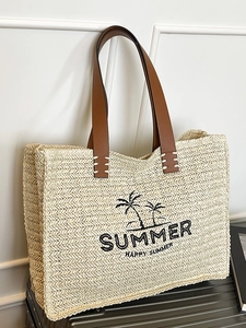 Woven straw summer beach tote bag with embroidered palm tree and brown leather handles