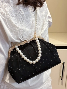 Elegant black velvet pleated evening bag with pearl handle and rhinestone metal frame