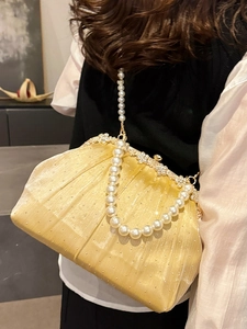 Elegant gold pleated evening clutch with rhinestone frame and pearl chain strap