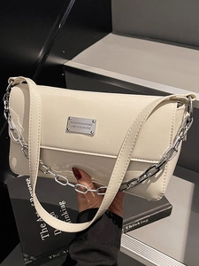 Minimalist cream patent leather baguette bag with thick silver chain and shoulder strap