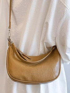 Minimalist brown litchi pattern leather crescent shoulder bag with silver hardware