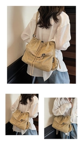 Detail of minimalist beige canvas crossbody bag showing large capacity and drawstrings