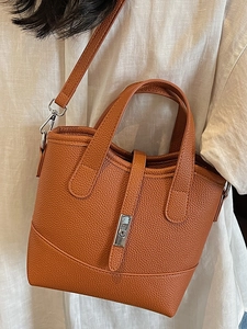 Brown lychee-texture tote bag with silver rotary lock and adjustable shoulder strap