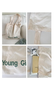 Close-up detail of reinforced stitching and green Young Girls embroidery on canvas tote