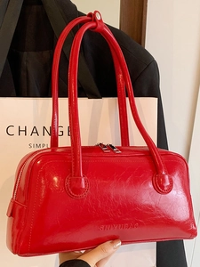 Glossy red Boston shoulder bag with top handles and a sleek rectangular pillow design