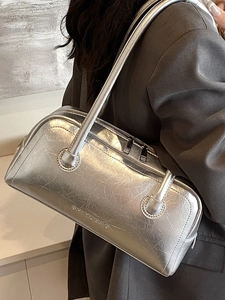 Silver metallic Boston shoulder bag with cracked texture leather on model for commute
