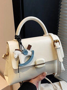 Elegant white square handbag with golden buckle and horse charm for modern women
