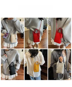 Close-up of woven mini crossbody phone bag available in various trendy summer colors