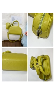 Vues détaillées du sac demi-lune vert clair avec finitions argentées et porte-monnaie