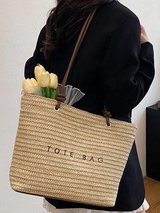 Straw woven tote bag for women with TOTE BAG embroidery and brown leather handles