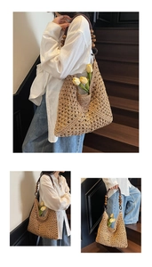 Detailed macro view of hand-woven straw tote bag with round brown wooden beads handle