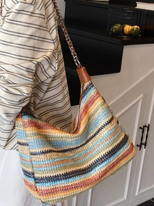 Colorful striped woven shoulder bag with metal chain strap and minimalist retro hobo design