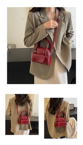Detailed views of a red glossy patent leather mini handbag with silver-tone hardware