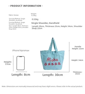 Detailed view of canvas tote bag size showing measurements with iPhone reference