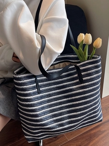 Large capacity striped woven tote bag with blue and white stripes and leather straps