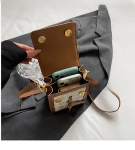 Detail view of the vintage print crossbody bag interior showing spacious compartments
