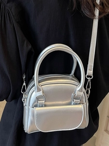 Silver metallic mini square handbag with top handles and adjustable shoulder strap