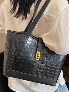 Minimalist black crocodile embossed tote bag with gold buckle for women in office casual style
