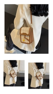 Detail view of mini crossbody phone bag featuring F-letter quilting and brown leather piping