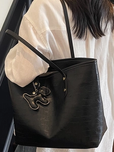 Minimalist black crocodile embossed tote bag for women with cute animal charm decoration