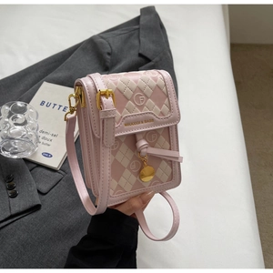 Close-up of pink and beige mini crossbody bag with quilted texture and gold hardware