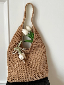 Hollow woven tote bag for women with pearl tulip pendant in natural khaki brown color