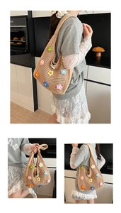 Close-up of handmade crochet tote bag with colorful 3D floral embroidery details