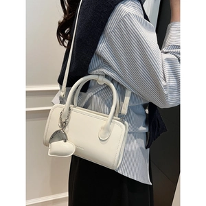 White PU leather bowling handbag with heart charm and shoulder strap for women