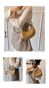 Detail of khaki half-moon bag with unique round handle and sphere decorative accents